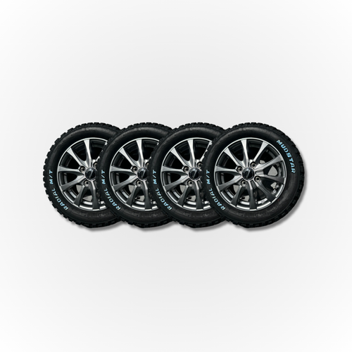 Four alloy wheels slightly overlapping, all fitted with Mudstar Radial tyres