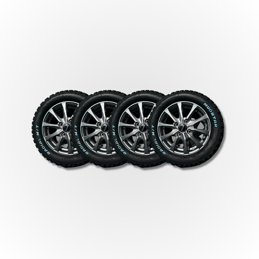 Four alloy wheels slightly overlapping, all fitted with Mudstar Radial tyres