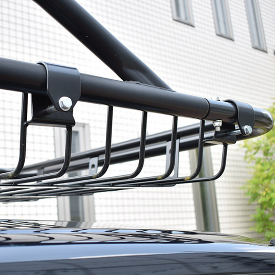 Close up of the Hard Cargo Roof Basket attached to the top of a black Hijet