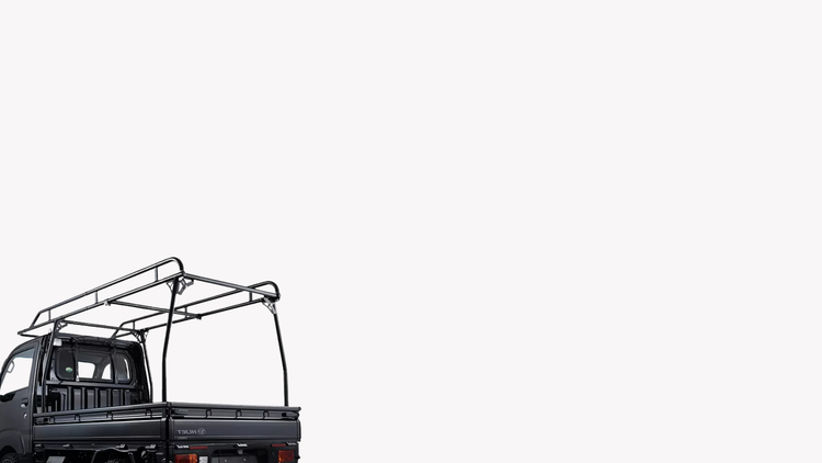 A black Daihatsu Hijet with a Hard Cargo Work Carrier on a white background