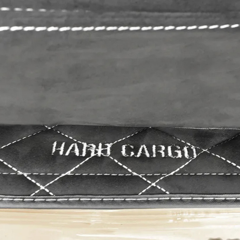 Load image into Gallery viewer, Close up of the Hard Cargo logo on the Hard Cargo Deck Cover
