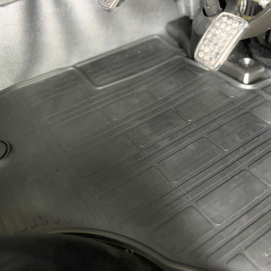 The Davey Motor Group Daihatsu Hijet Standard Rubber Floor Mats shown installed in a white coloured Daihatsu Hijet