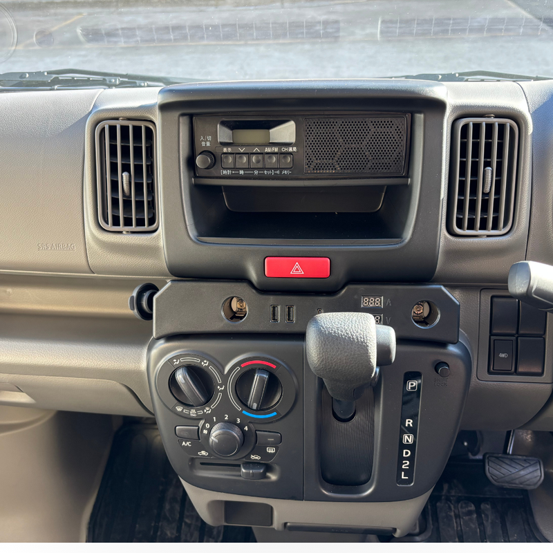 Load image into Gallery viewer, A Cigarette Lighter Extender for the Suzuki Every installed in the dashboard of a Suzuki Every
