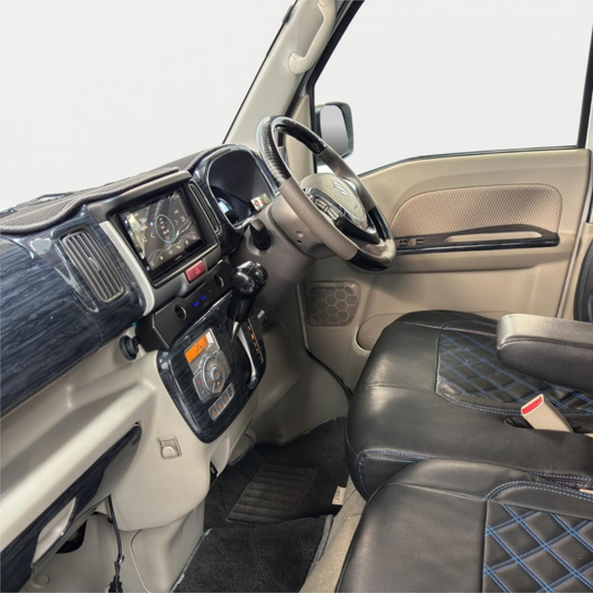 A Cigarette Lighter Extender for the Suzuki Every installed in the dashboard of a Suzuki Every