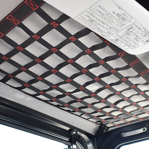 A black Hard Cargo Roof Net (standard size) attached to the roof of a Daihatsu Hijet