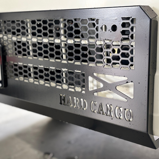 A close up of the black Hard Cargo Skid Grille 