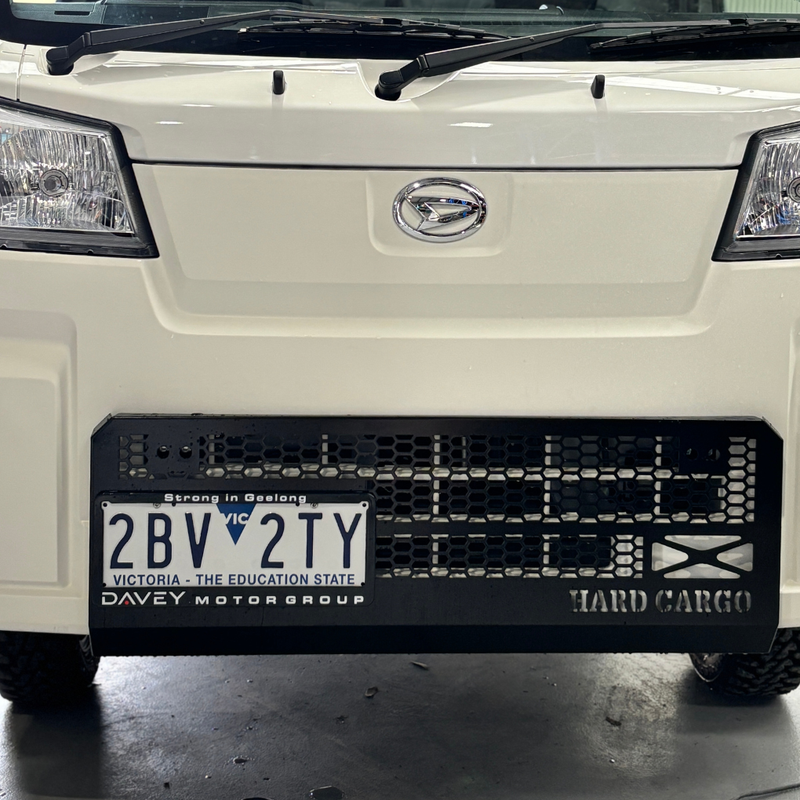 Load image into Gallery viewer, A Hard Cargo Skid Grille Installed on a white Daihatsu Hijet
