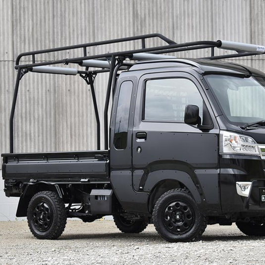 A Hard Cargo Work Carrier installed on a black Daihatsu Hijet
