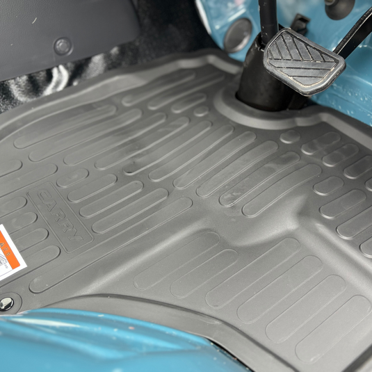 The Davey Motor Group Suzuki Carry High Wall Rubber Floor Mats shown installed in a teal coloured Suzuki Carry