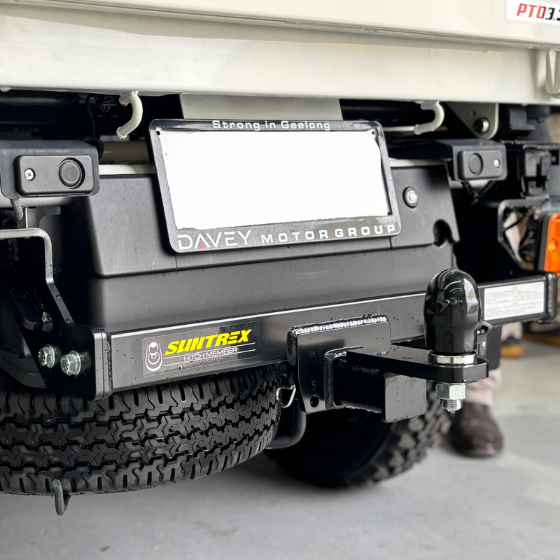 Load image into Gallery viewer, A close up of the installed Towbar on the back of a cream Daihatsu Hijet
