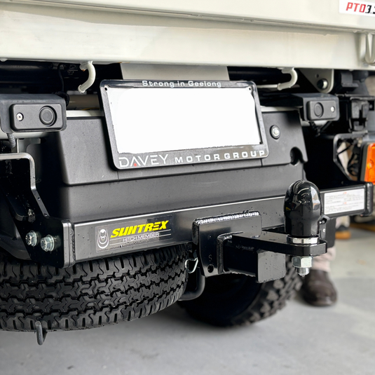 A close up of the installed Towbar on the back of a cream Daihatsu Hijet
