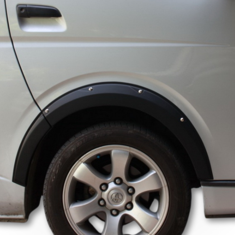 Load image into Gallery viewer, The Davey Motor Group Toyota HiAce Overfenders installed on the Front Right wheel arch of a silver Toyota HiAce

